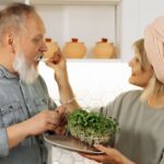 older-couple-looking-at-house